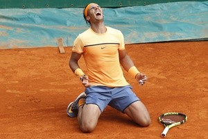 Spain's Rafael Nadal celebrates after defeating France's Gael Monfils during the final tennis match at the Monte-Carlo ATP Masters Series Tournament in Monaco on April 17, 2016.   AFP PHOTO / VALERY HACHE / AFP / VALERY HACHE        (Photo credit should read VALERY HACHE/AFP/Getty Images)