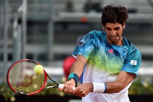 ROME, ITALY - MAY 09: Tomaz Bellucci of Brazil plays a backhand in his match against Gael Monfils of France on Day Two of The Internazionali BNL d'Italia 2016 on May 09, 2016 in Rome, Italy. (Photo by Dennis Grombkowski/Getty Images)