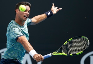 MELBOURNE, AUSTRALIA - JANUARY 17: Rogerio Dutra Silva of Brazil plays a backhand during his first round match against Jared Donaldson of the USA on day two of the 2017 Australian Open at Melbourne Park on January 17, 2017 in Melbourne, Australia. (Photo by Darrian Traynor/Getty Images)