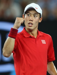 MELBOURNE, AUSTRALIA - JANUARY 22: Kei Nishikori of Japan celebrates a point in his fourth round match against Roger Federer of Switzerland on day seven of the 2017 Australian Open at Melbourne Park on January 22, 2017 in Melbourne, Australia. (Photo by Clive Brunskill/Getty Images)