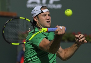 Jack Sock returns a shot to Kei Nishikori, of Japan, at the BNP Paribas Open tennis tournament, Friday, March 17, 2017, in Indian Wells, Calif. Sock won 6-3, 2-6, 6-2. (AP Photo/Mark J. Terrill)